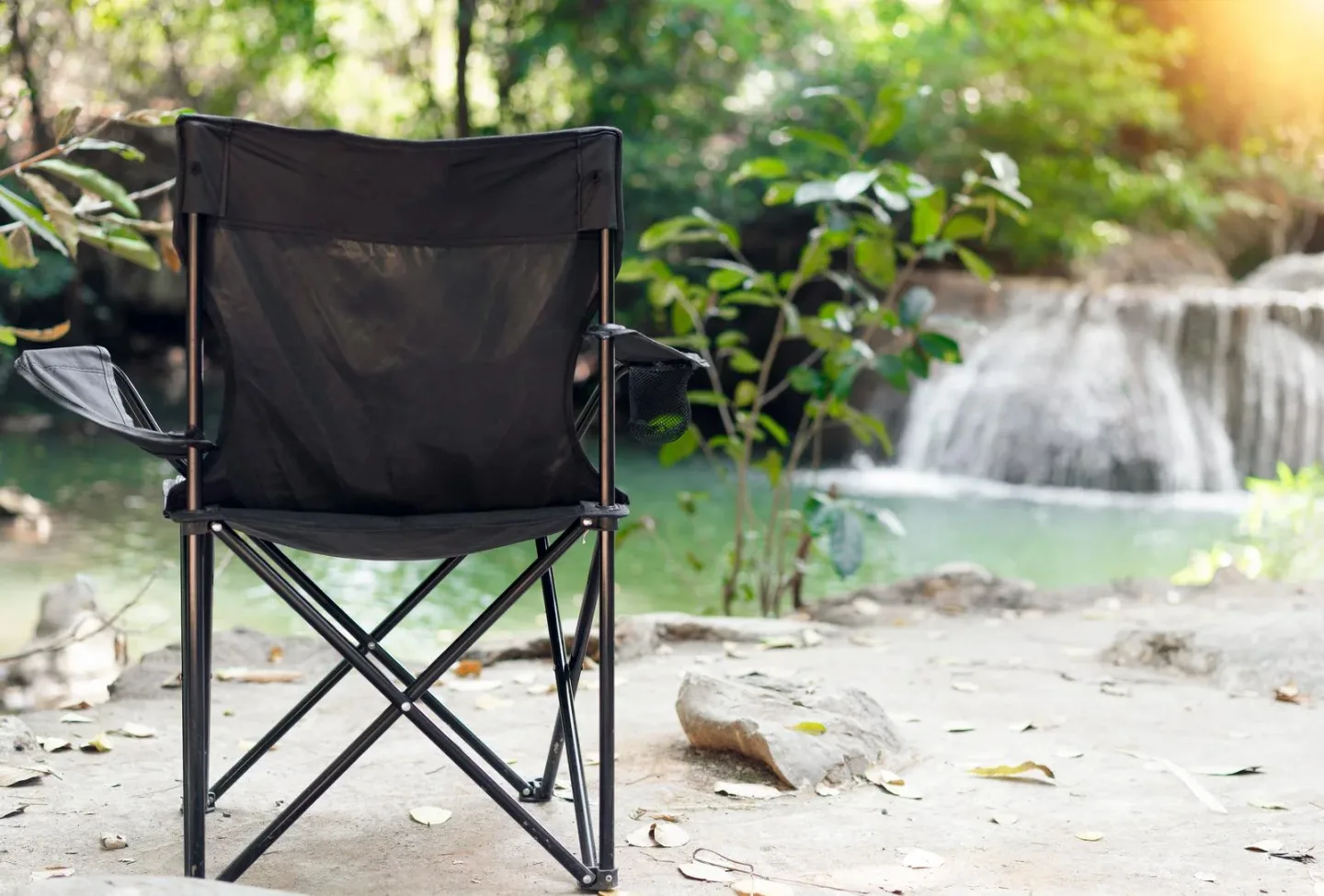 comfortable camping chairs near the waterfall