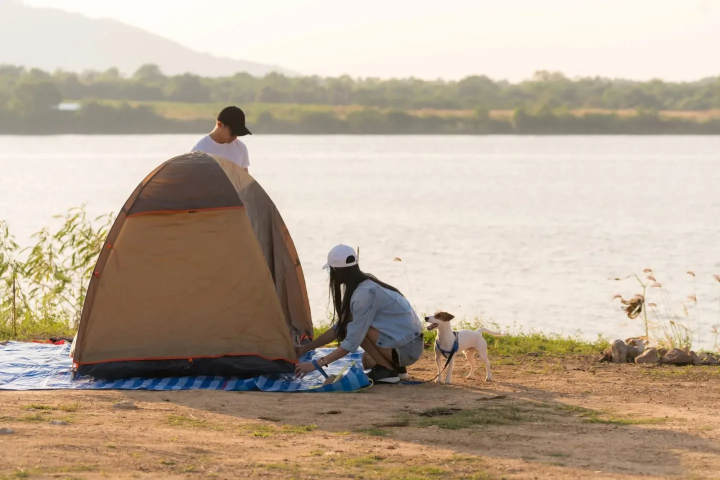 couple setting up a campsite